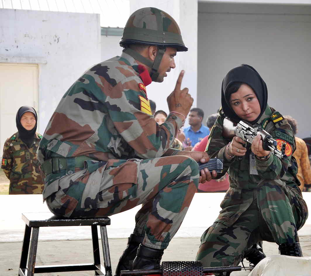AIM RIGHT: An Afghan woman cadet takes a small arms simulator firing practice, at Officers Training Academy (OTA), in Chennai, UNI