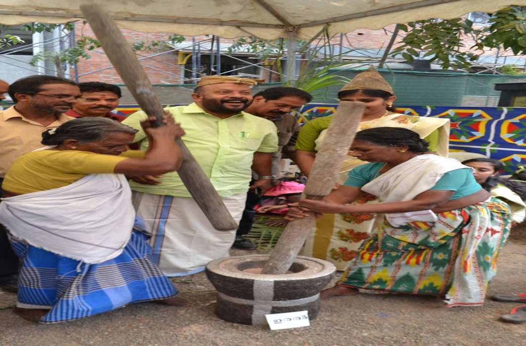 WAYS OF OUR WORLD: Elderly women exhibit their skills of de-husking paddy in a traditional manner in presence of agriculture minister VS Sunil Kumar during an exhibition in Thiruvananthapuram, UNI
