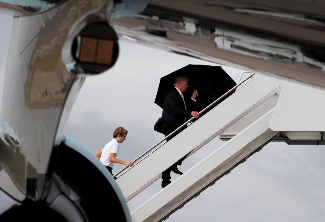 IN HIS FOOTSTEPS: US President Donald Trump and his son Barron board Air Force One as he departs West Palm Beach, Florida, US, Reuters/UNI