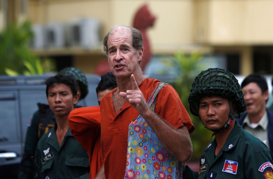 ACCUSED OF SPYING: Australian filmmaker James Ricketson (centre) speaks to the media at the Supreme Court in Phnom Penh, Cambodia, Reuters/UNI