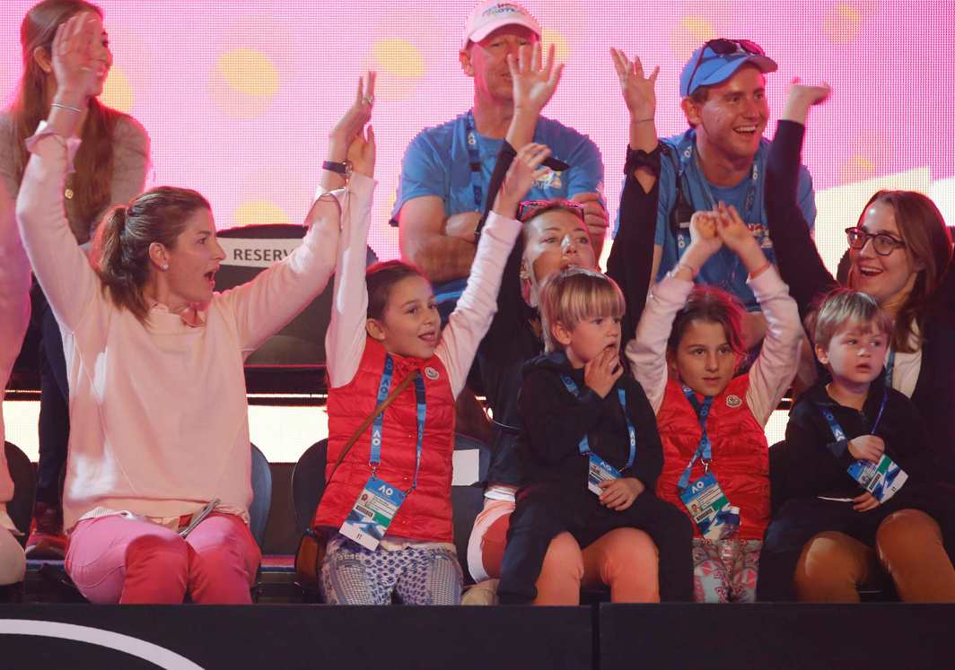 TENNIS MOM: Mirka Federer, wife of Roger of Switzerland, raises hands with their children as the family attends Kids Tennis Day before the Australian Open tennis tournament at the Rod Laver Arena, Melbourne, Reuters/UNI