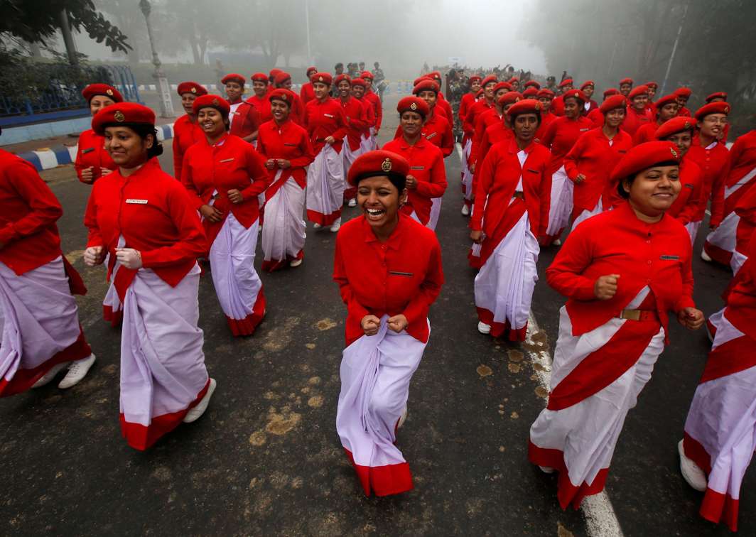 LAUGH AWAY ALLERGIES: Indian civil defence personnel laugh before they start their rehearsals for the Republic Day parade on a winter morning in Kolkata, India, Reuters/UNI