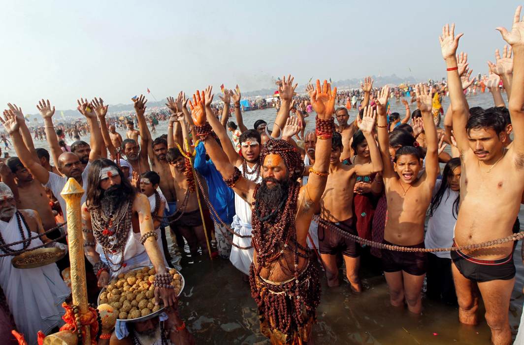 BRAVING DISCOMFORT: Sadhus and devotees pray as they take a holy dip at Sangam, the confluence of the Ganges, Yamuna and Saraswati rivers, during Magh Mela festival in Allahabad, Reuters/UNI