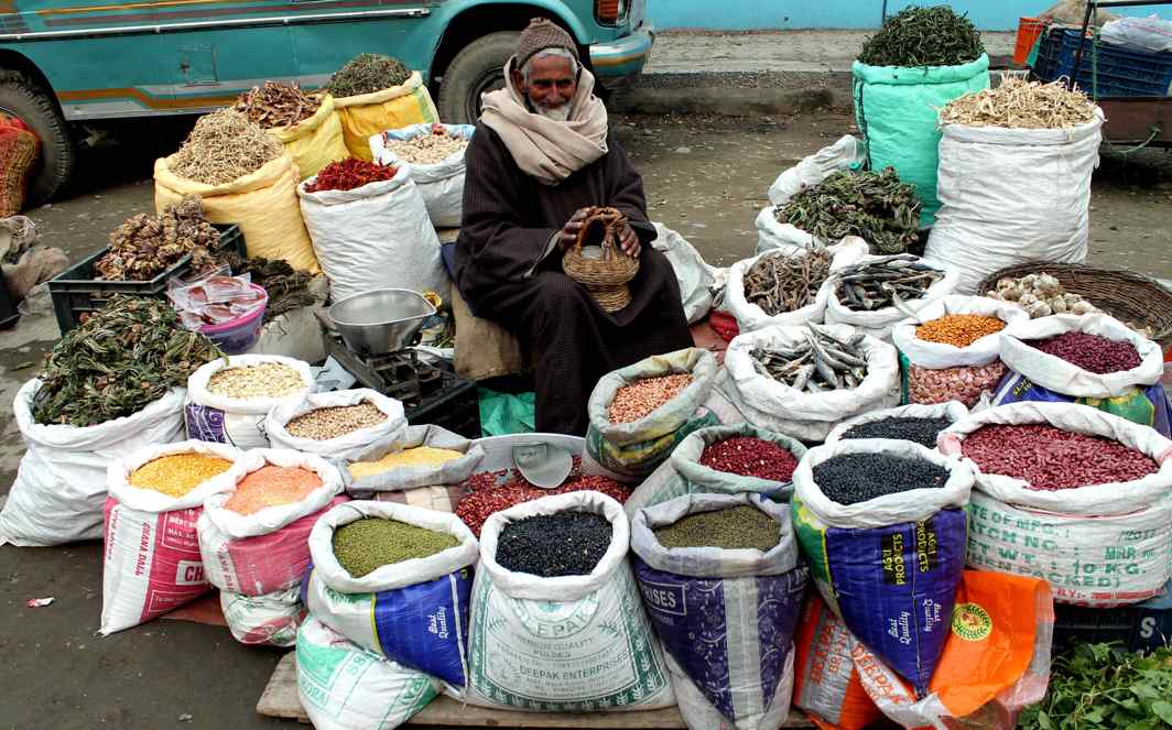 KING OF SPICE: An elderly shopkeeper selling spices and pulses which are in great demand during winter months, at his roadside shop in Srinagar, UNI