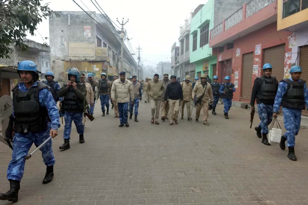 TOO LITTLE TOO LATE: Security forces conduct a flag march to maintain law and order after communal clashes, in Kasganj, Uttar Pradesh, UNI