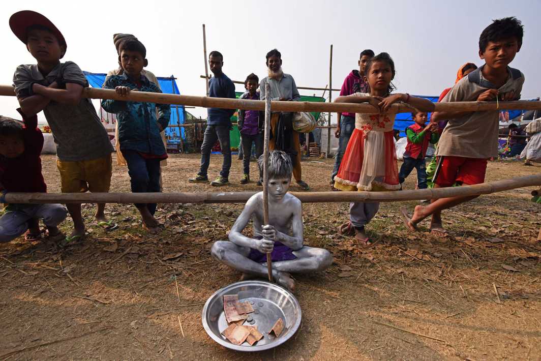 GIVE ME MONEY: A boy begs for alms at the Jonbeel Mela, where people belonging to different tribes exchange their merchandise with locals through a barter system, in the Morigaon district, in the northeastern state of Assam, India, Reuters/UNI