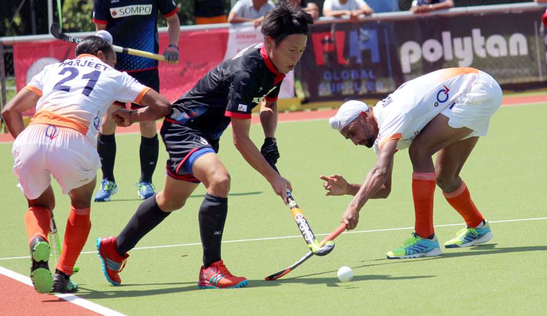 DRIBBLE AND DODGE: Players of India and Japan in action during their match of the Four Nations' Invitational Hockey Tournament, in Hamilton, India beat Japan by 4-2, UNI