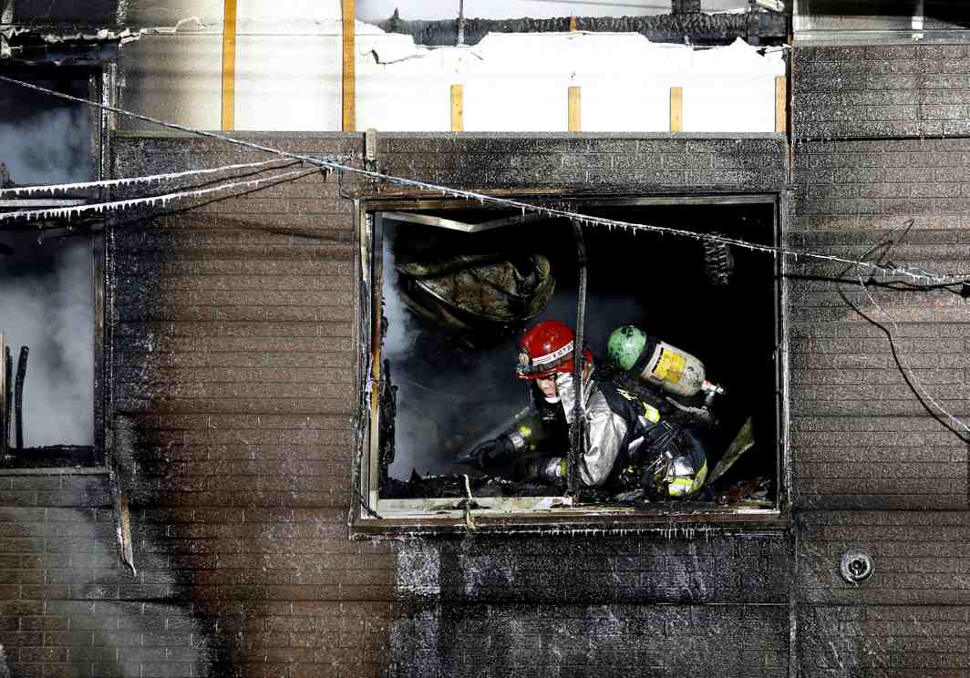 CARE AND SUPPORT: A firefighter inspects a facility to support senior people on welfare, where a fire occurred, in Sapporo, Japan, Kyodo/Reuters/UNI