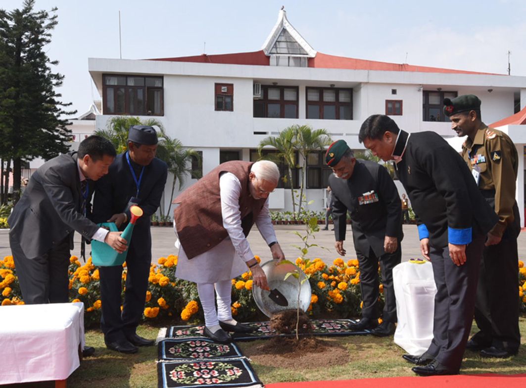GREEN FINGERS: Prime Minister Narendra Modi plants a sapling at Governor House in Itanagar. Arunachal Pradesh Governor Brigadier BD Mishra (retired) and Chief Minister Pema Khandu are also seen, UNI