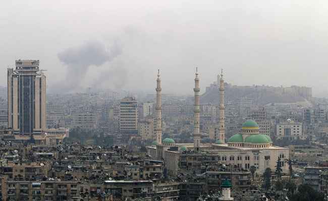 ONCE MAGNIFICIENT: Smoke rises after an airstrike in Aleppo; courtesy Reuters